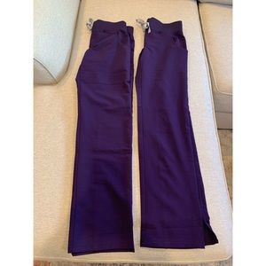 Two pair of womens kade cargo scrub pants in purple xxs